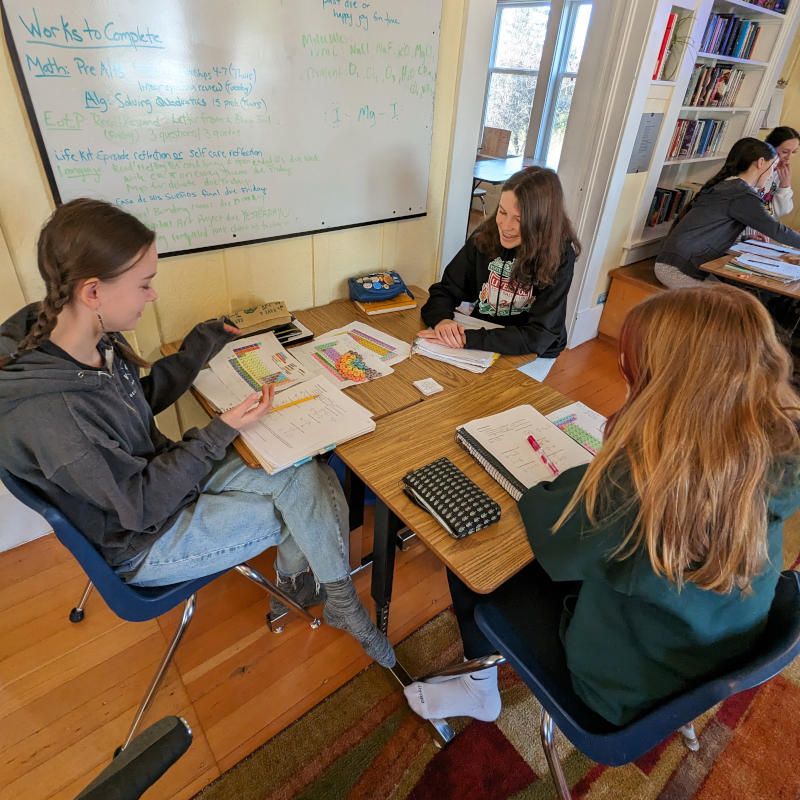 Students working at tables in the classroom